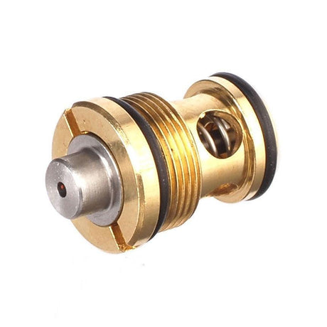 Close-up of a brass airsoft magazine valve part with spring and black O-rings