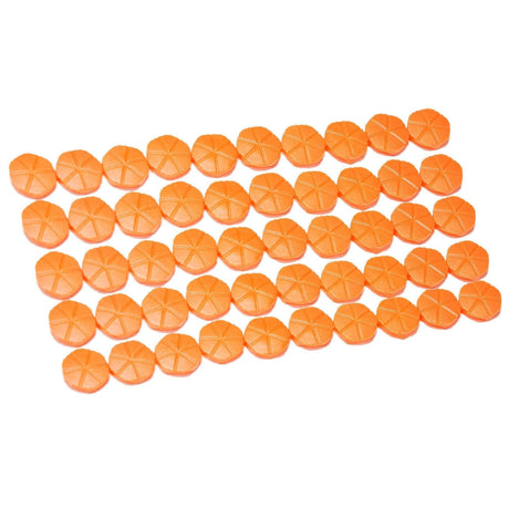 Rows of orange plastic magazine shell parts for shotguns on white background