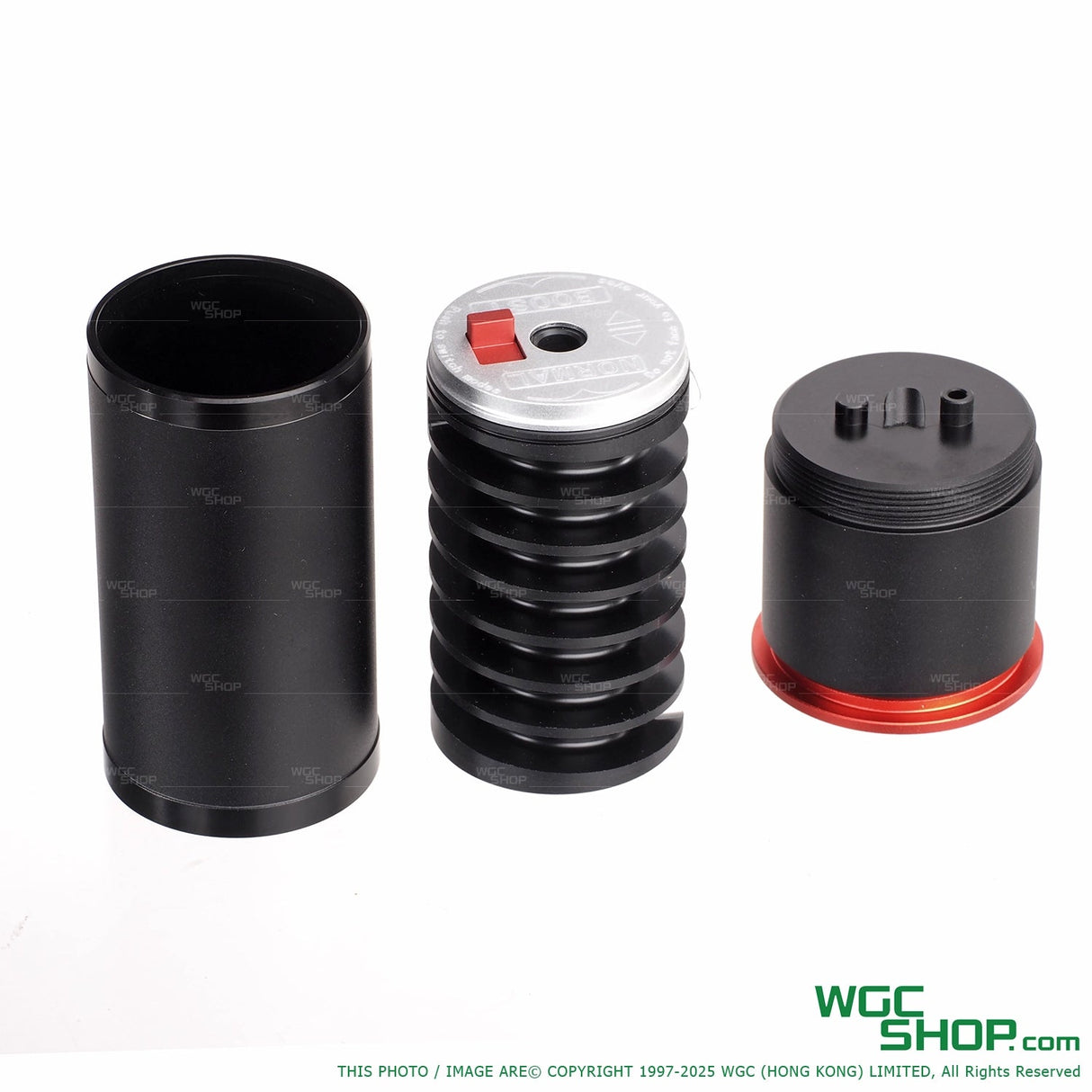 Disassembled 40mm Max Cyclops airsoft grenade with black cylindrical parts and adjustable velocity top