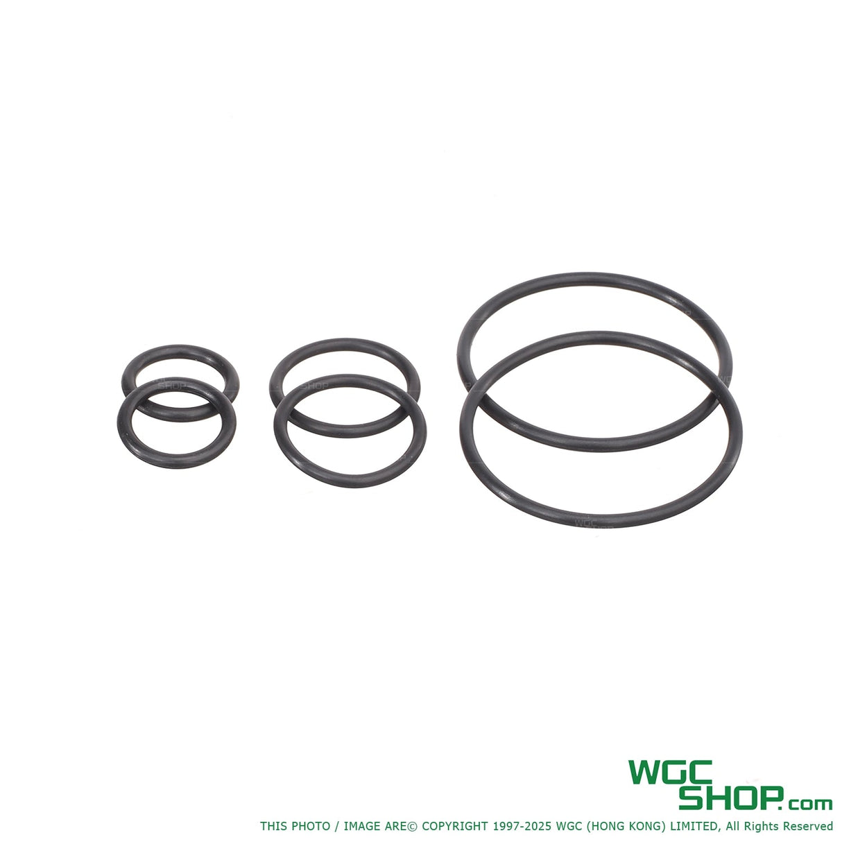 Set of six black rubber O-rings in three different sizes on white background