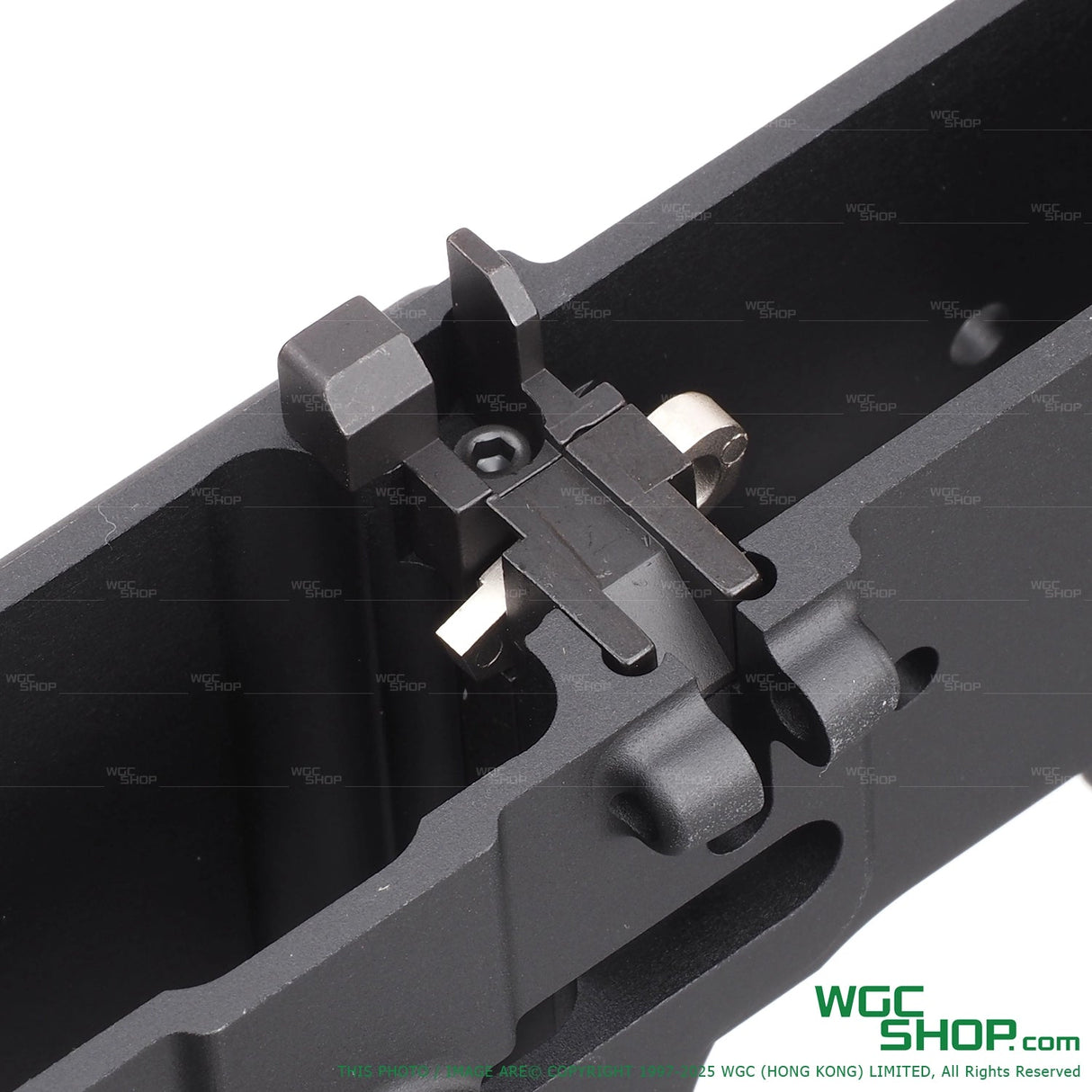 Close-up of DNA receiver kit for T91 GBB airsoft gun, showing black metal components inside receiver frame