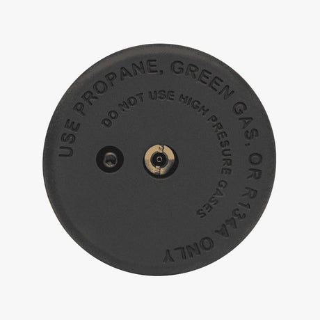 Top view of black airsoft frag grenade with use propane green gas warning text